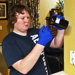 Matt Elenniss pouring DOT solution into graduated cylinder Matt Elenniss pouring DOT solution into graduated cylinder